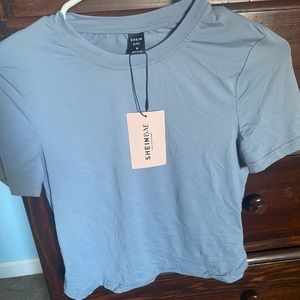 Brand new blue tight fitted tee